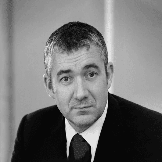 Black and white portrait of founding partner Frank Copplestone